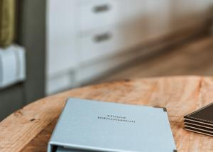 a book sitting on top of a wooden table at The Astbury Golf And Lodge Resort in Bridgnorth