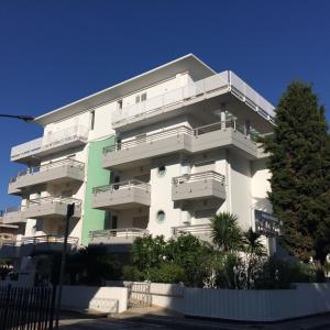 a white building with balconies on the side of it at Residence Dolce Vita in San Benedetto del Tronto