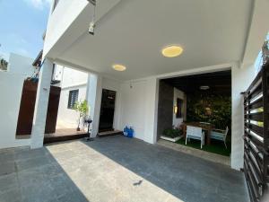 a hallway of a house with a table and chairs at Casa Buenafe in Antipolo