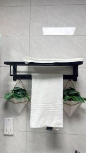 a counter in a bathroom with towels on it at The Captains Suite in Gaborone