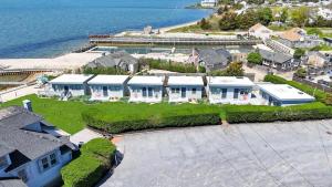 an aerial view of a large house with a yard at The Inn Spot in Hampton Bays