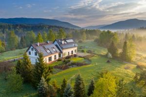 an aerial view of a house on a hill at Gościniec Horb in Wetlina