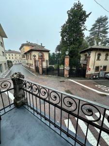 a balcony with a black fence and a street at L'Angolo di Mede in Mede