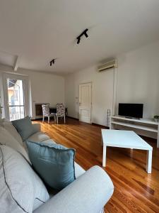 a living room with a couch and a table at L'Angolo di Mede in Mede