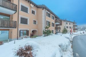 a pile of snow in front of a building at Chesa Blaunca B4 in Maloja