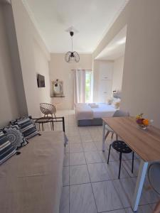 a living room with a couch and a bed at Mare blu Lefkada in Nydri +53 photos