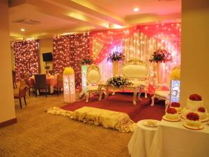 a room with two chairs and a stage with lights at Seascape Hotel in Dar es Salaam +48 photos