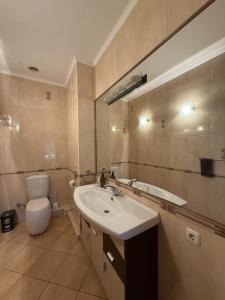 a bathroom with a sink and a toilet at Дом в Аркадии - море рядом! in Odesa +39 photos