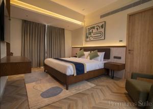 a hotel room with a bed and a couch at Basilica Resort, Lonavala in Lonavala +39 photos