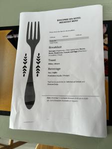 a paper receipt with a fork on top of it at Boscombe Spa Hotel in Bournemouth