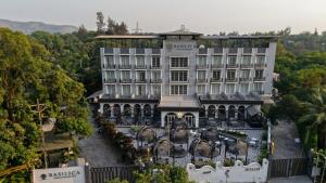 an aerial view of a hotel with elephants in front of it at Basilica Resort, Lonavala in Lonavala