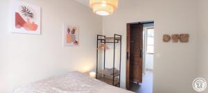 a bedroom with a bed and a shelf in it at Le cadre in Bonnières