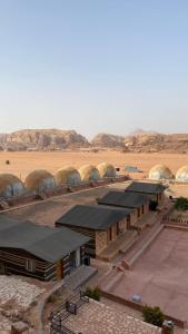 a group of domes in the middle of a desert at Golden Camp- wadi rum in Wadi Rum