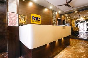 a lobby of a hotel with a reception desk at FabHotel Prasad International in Mumbai