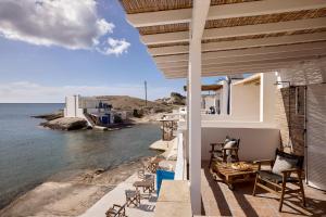 a balcony of a house with a view of the ocean at Infinito Boathouse Milos in Agia Irini Milos