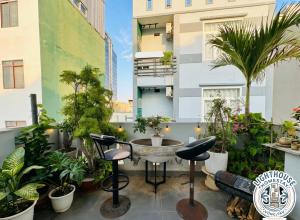a rooftop patio with plants and a fountain at Lighthouse Homestay Vũng Tàu in Vung Tau