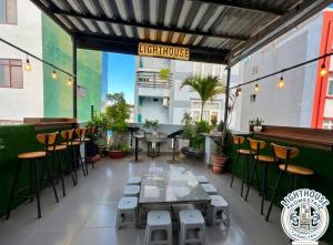a restaurant with a long table and chairs at Lighthouse Homestay Vũng Tàu in Vung Tau
