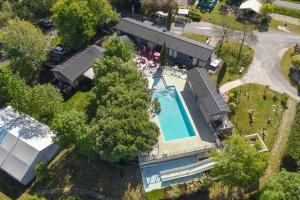 an aerial view of a house with a swimming pool at Camping les Coteaux du Lac in Chemillé-sur-Indrois
