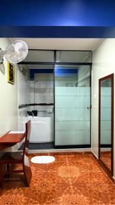 a room with a table and a glass door at Horus Suite Hotel in Jaén