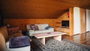 a living room with a couch and a table at Alpenblick-Raggal in Raggal
