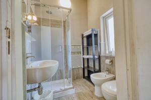 a bathroom with a sink and a shower and a toilet at Hotel Everest - Bar e Ristorante in Gabicce Mare +130 photos