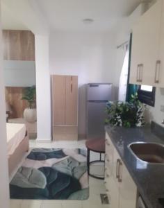 a kitchen with a sink and a counter top at CoCo Nest Cozy Modern Studio Near Mamsha Beach & Airport in Hurghada