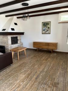 a living room with a fireplace and a table at Villa Maslina in Novalja +74 photos