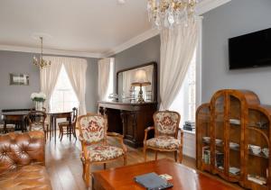 a living room with a couch and a table at Bishop's Gate Hotel in Derry Londonderry