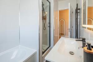 a white bathroom with a sink and a shower at 3 Bed in Skegness oc-b33460 in Orby +23 photos