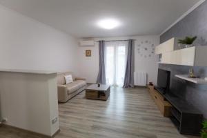 a living room with a couch and a fireplace at Casa Serena in Rivarolo del Re ed Uniti
