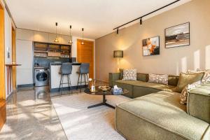 a living room with a couch and a table at The Iconic Spot - Pool and Sea View in Anfa-Supérieur