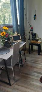 a room with a table with a laptop on it at Glamping sin salir de la CDMX in Mexico City