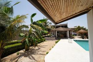 a view of a resort with a swimming pool at Toubakouta River Paradise in Toubakouta