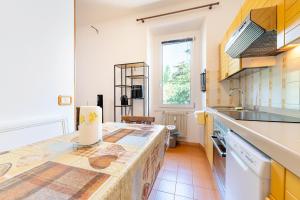 a kitchen with a counter top and a sink at Arco Park View By Immobilux in Arco