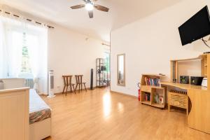 a living room with a flat screen tv on the wall at Arco Park View By Immobilux in Arco