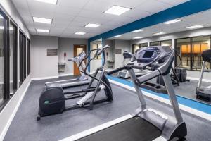 a gym with two treadmills and a treadmill at Garner Hotel Frederick Southeast by IHG in Frederick