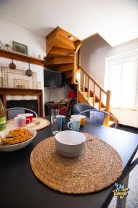 a table with plates of food on top of it at Le Petit Noirda in Audresselles