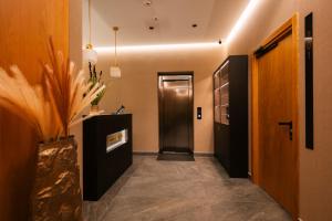 a hallway with a door and a hallway sidx sidx sidx at Diplomatico Hotel in Odesa