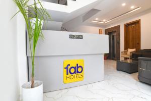 a frito lay office with a frito lay logo on a wall at FabHotel Trivana, Mahalaxmi Nagar in Indore