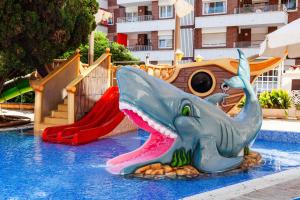 a water park with a slide and an elephant in the water at Hotel Bon Repos in Calella