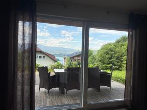a view of a table and chairs from a window at Schönblick in Oberaichwald