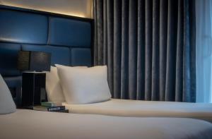 a hotel room with a bed and a window at The Residence Hotel in Galway