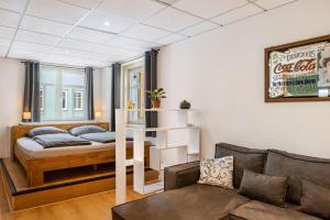 a living room with a bed and a couch at Ferien- und Handwerkerwohnung in Römhild