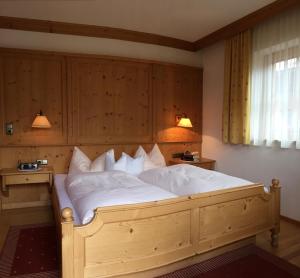 Łóżko lub łóżka w pokoju w obiekcie Wellnessappartements Margit