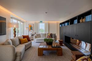 a living room with a couch and a fireplace at Casas da Quinta de Santa Cruz - Douro Land in Peso da Régua