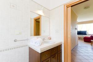 a bathroom with a sink and a mirror at Casale Rustico ColleBello in Castiglione Messer Raimondo +57 photos