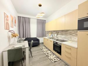 a kitchen with a table and a dining room at Residence Meraviglia in Schio