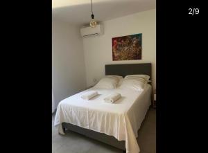 a bedroom with a bed with two towels on it at Résidence Arborea C3 Corte in Corte