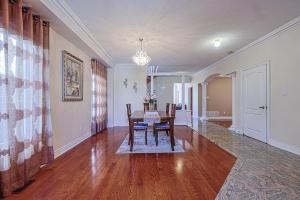 a dining room with a table and chairs at Harmony House in Richmond Hill +15 photos
