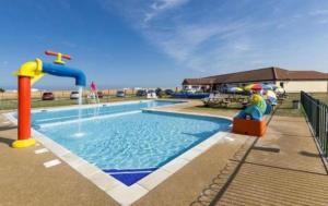 a pool with a water slide and a water park at Aqua bay whistable in Swalecliffe